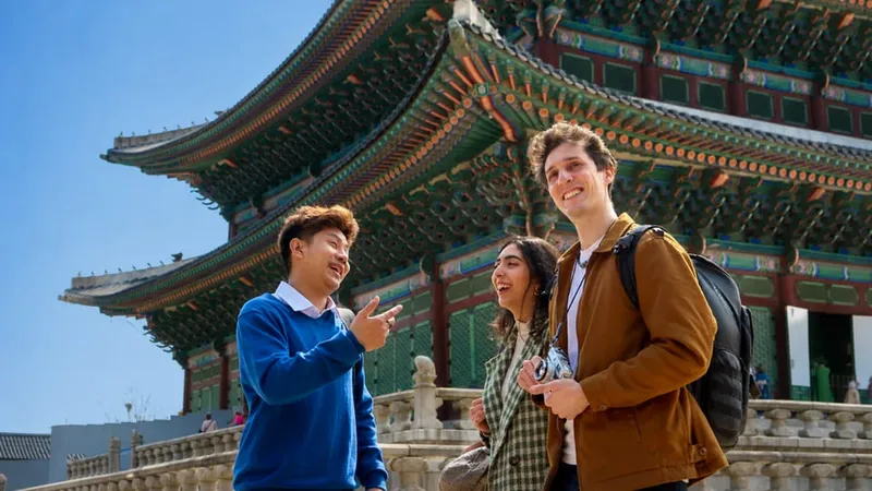 Local host guiding a visitor through a creative backstreet on a seoul private tours hidden-gems walk in Seoul, South Korea