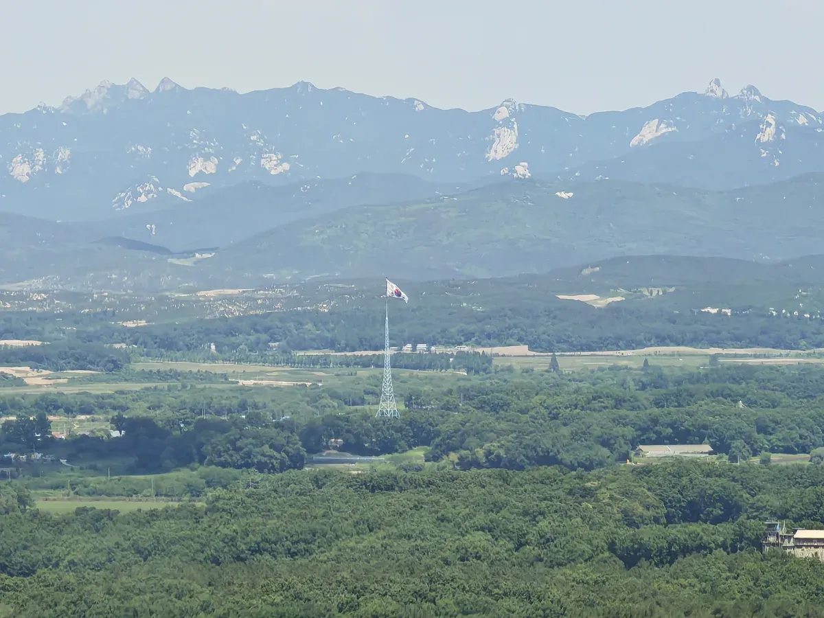 Flagpole and fields of North Korea seen from Dora Observatory on a DMZ tour from Seoul